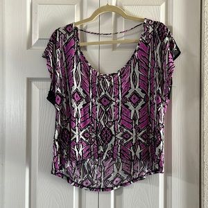 High low design and mesh. Fun tribal pattern with a popping hot pink color